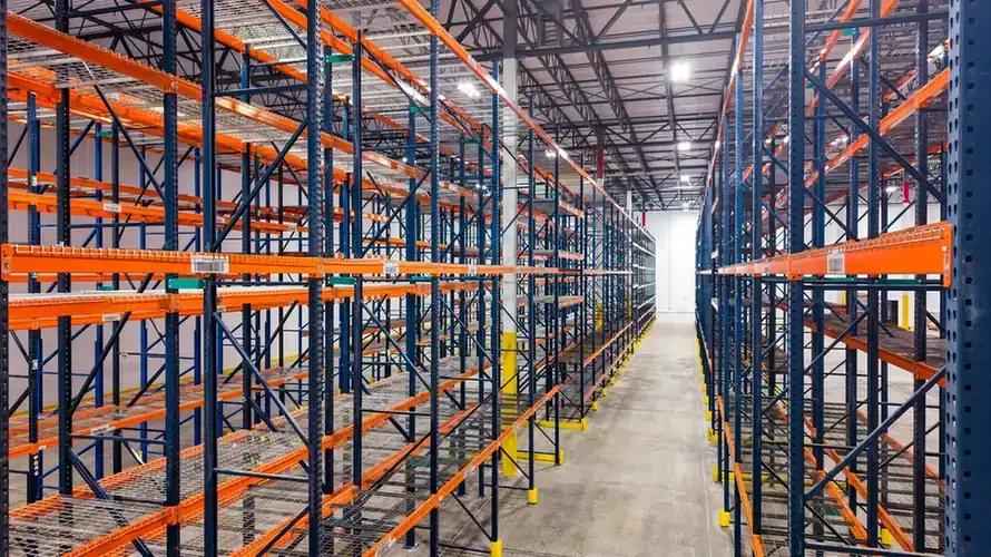 Long aisles between warehouse pallet racks.