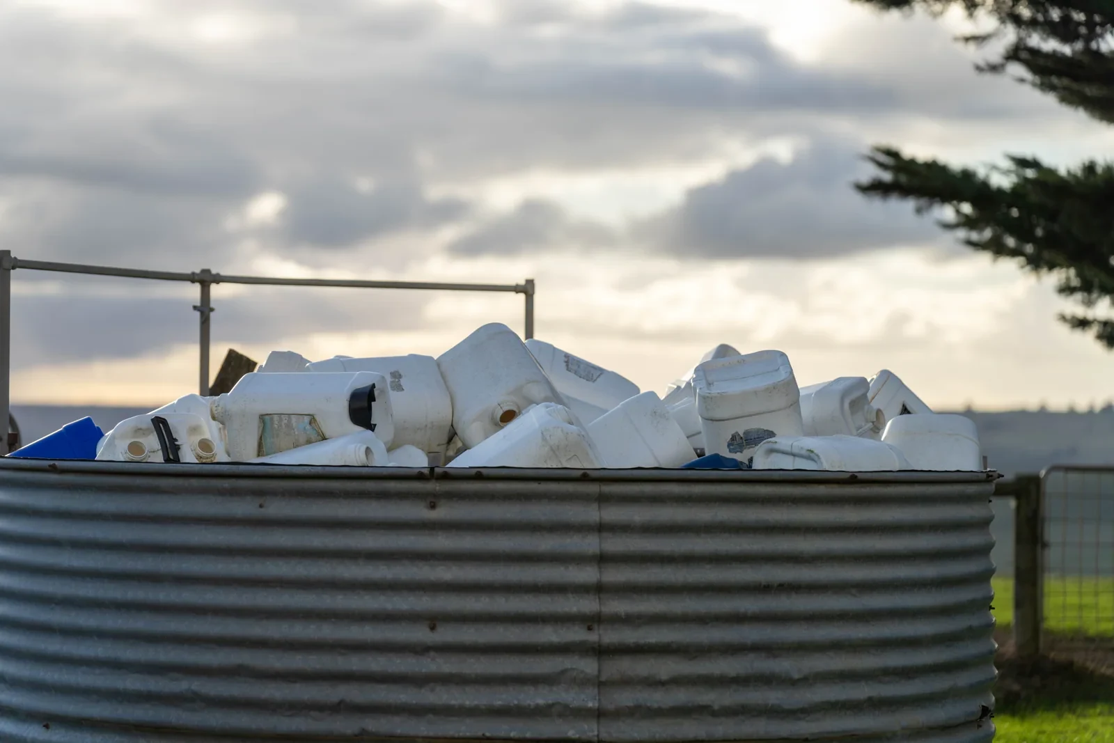 Used agricultural chemical containers collected at a farm.