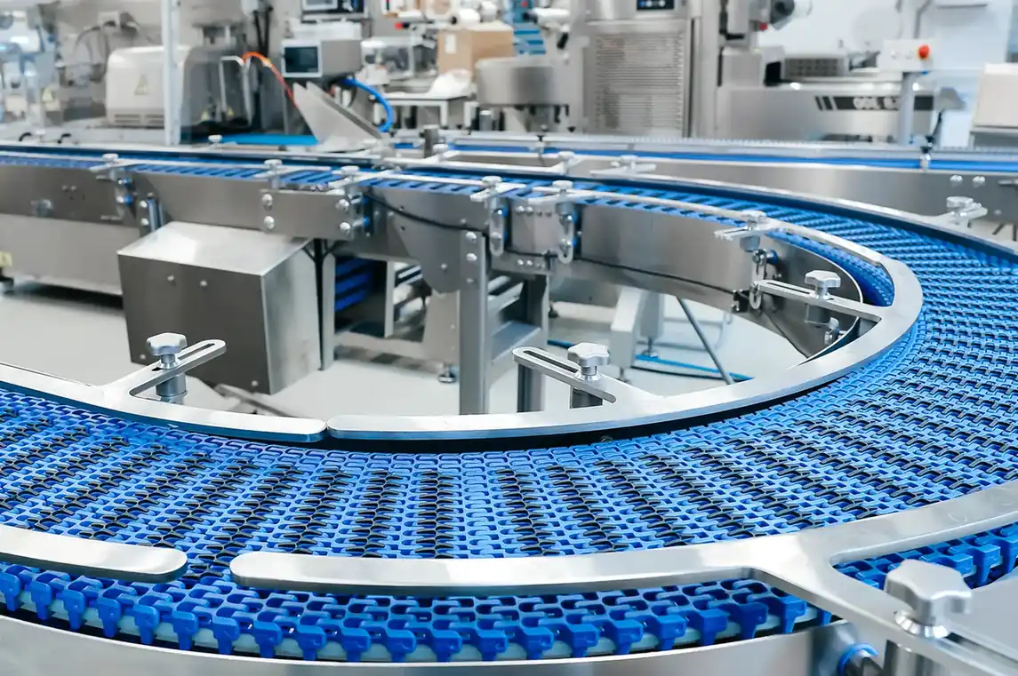 Empty blue conveyor belt and accessible production-line equipment.