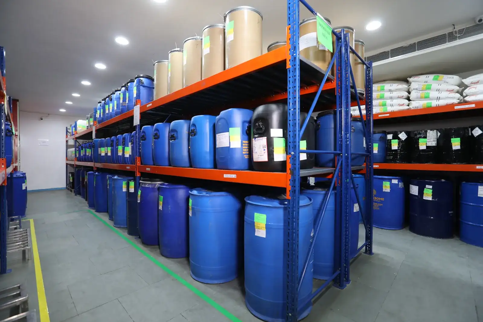 Blue storage containers in a pharmaceutical warehouse.